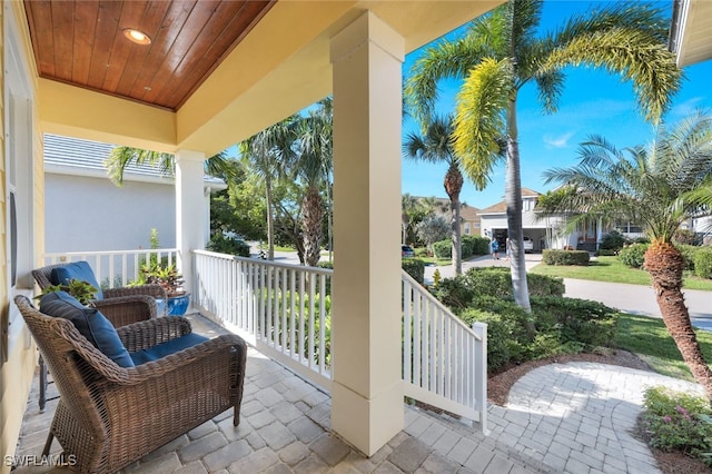 balcony featuring covered porch