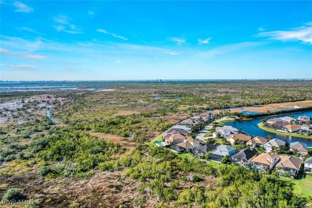 birds eye view of property with a residential view and a water view