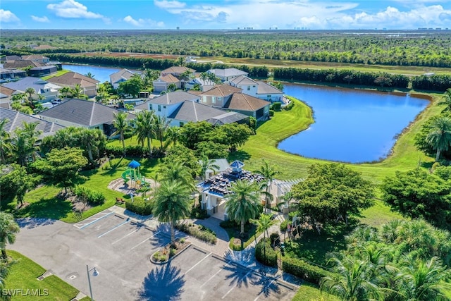 drone / aerial view with a residential view and a water view