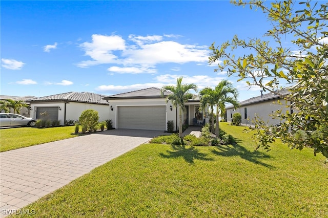 ranch-style home featuring a garage and a front lawn