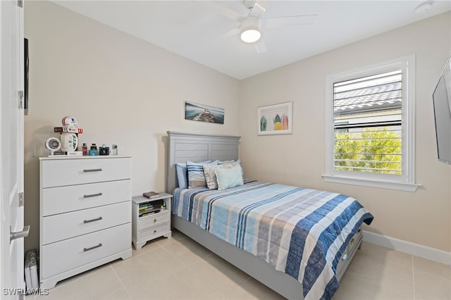 bedroom featuring ceiling fan and light tile patterned flooring