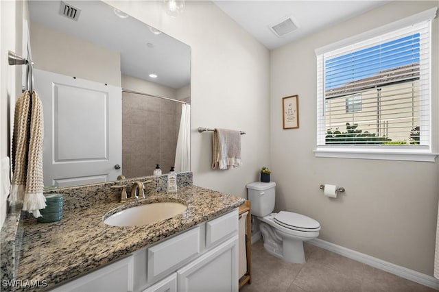 bathroom featuring walk in shower, tile patterned flooring, vanity, and toilet