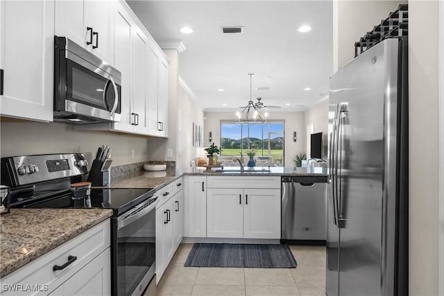 kitchen featuring white cabinetry, sink, crown molding, stone countertops, and appliances with stainless steel finishes