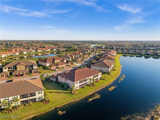 drone / aerial view with a water view