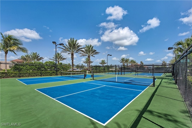 view of tennis court featuring basketball court