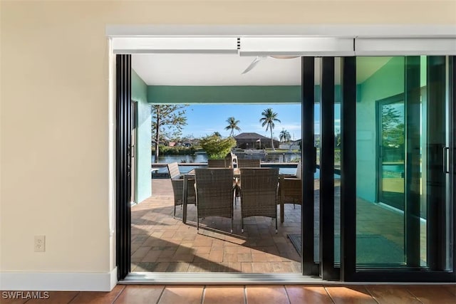 doorway to outside featuring a water view