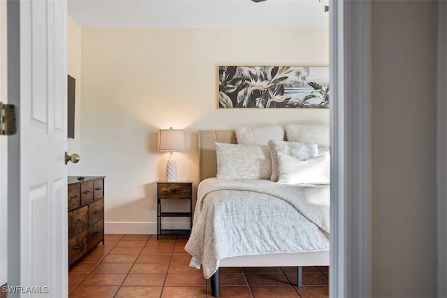 bedroom featuring light tile patterned flooring