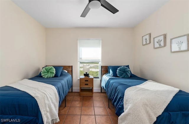 bedroom featuring tile patterned floors and ceiling fan