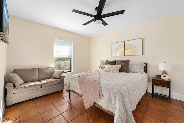 tiled bedroom with ceiling fan