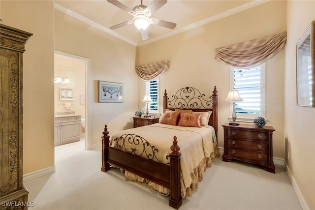 carpeted bedroom featuring ensuite bath, ceiling fan, and ornamental molding