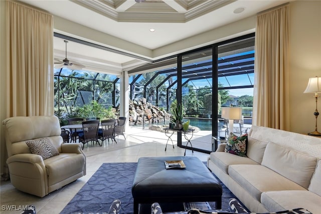 living room featuring light tile patterned floors, ceiling fan, and ornamental molding