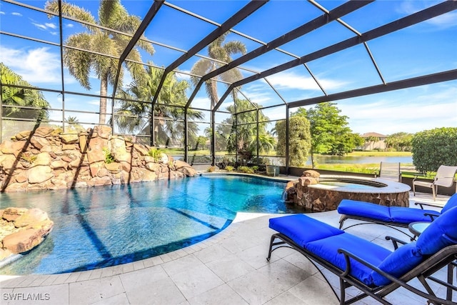 view of pool featuring glass enclosure, a water view, pool water feature, an in ground hot tub, and a patio