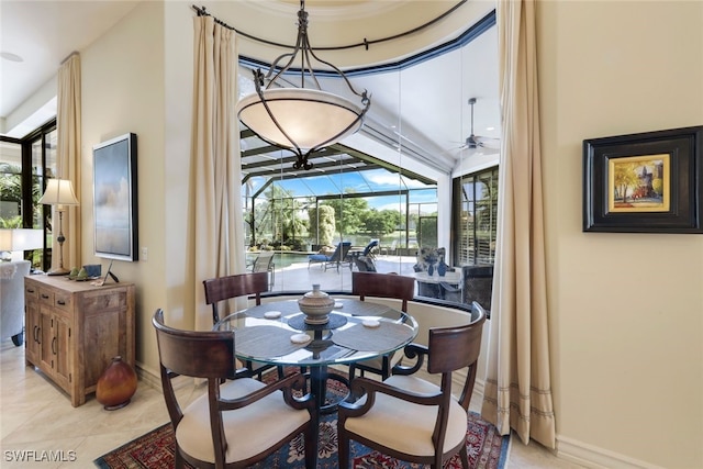 tiled dining area with ceiling fan