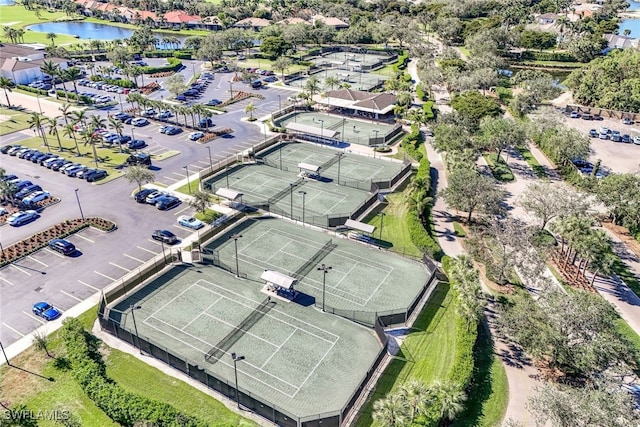 birds eye view of property with a water view