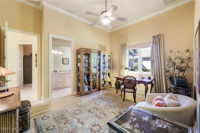 sitting room featuring ceiling fan, ornamental molding, and light hardwood / wood-style flooring