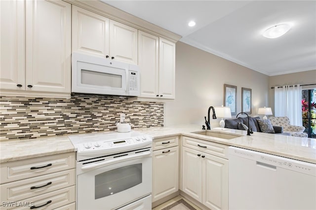 kitchen with white appliances, crown molding, sink, decorative backsplash, and light stone countertops