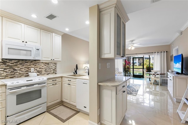 kitchen with kitchen peninsula, ornamental molding, white appliances, ceiling fan, and sink