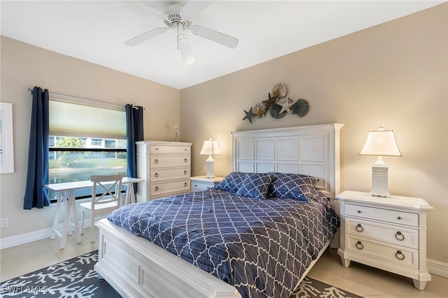 tiled bedroom with ceiling fan