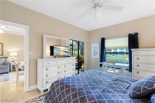 tiled bedroom featuring ceiling fan