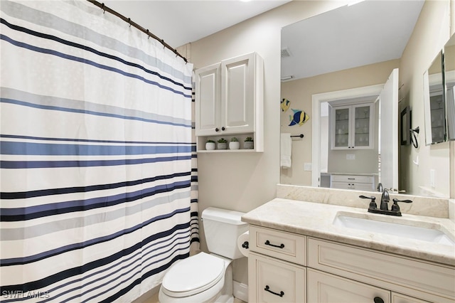 bathroom with vanity and toilet