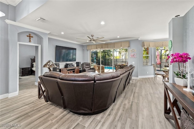 living room featuring light wood-type flooring, ceiling fan, and crown molding