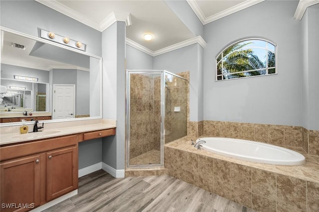 bathroom with wood-type flooring, vanity, separate shower and tub, and crown molding