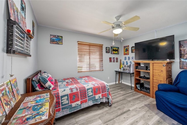 bedroom with hardwood / wood-style flooring and ceiling fan