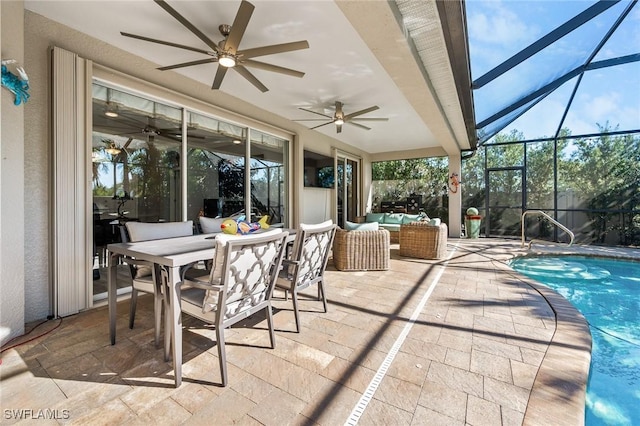 view of patio / terrace with a lanai, outdoor lounge area, and ceiling fan