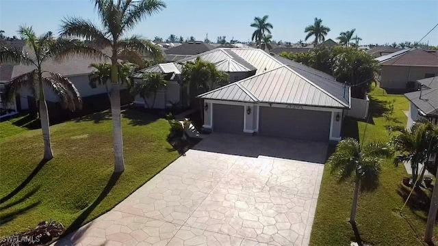 view of front facade with a garage and a front lawn