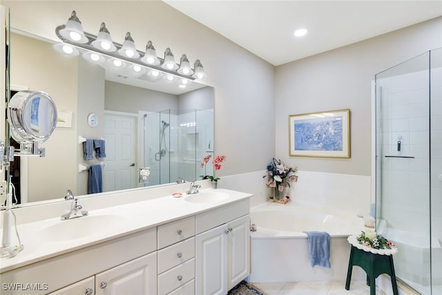 bathroom with vanity, tile patterned flooring, and plus walk in shower