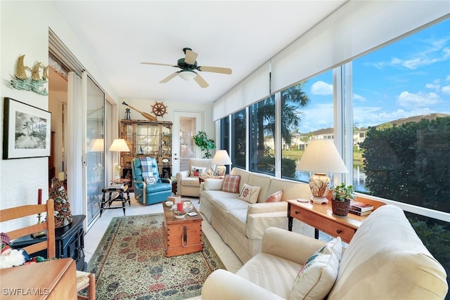 sunroom / solarium featuring ceiling fan