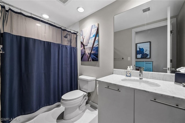 bathroom with walk in shower, vanity, and toilet