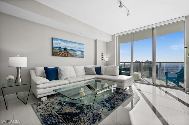 tiled living room featuring expansive windows