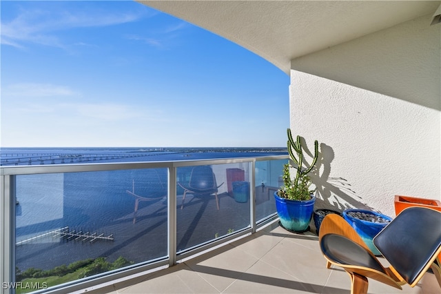 balcony featuring a water view