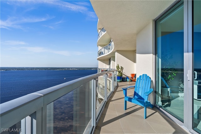 balcony featuring a water view