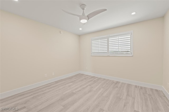 empty room featuring ceiling fan, recessed lighting, light wood-type flooring, and baseboards