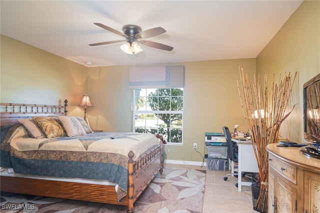 tiled bedroom with ceiling fan