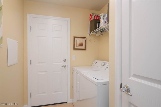 clothes washing area with independent washer and dryer