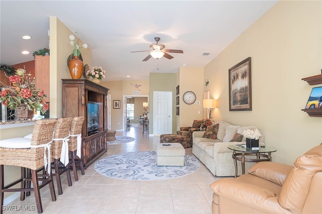 tiled living room featuring ceiling fan