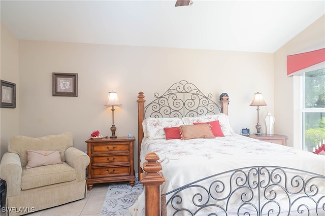 tiled bedroom with lofted ceiling