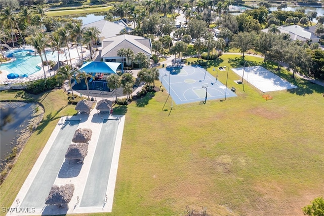 birds eye view of property with a water view