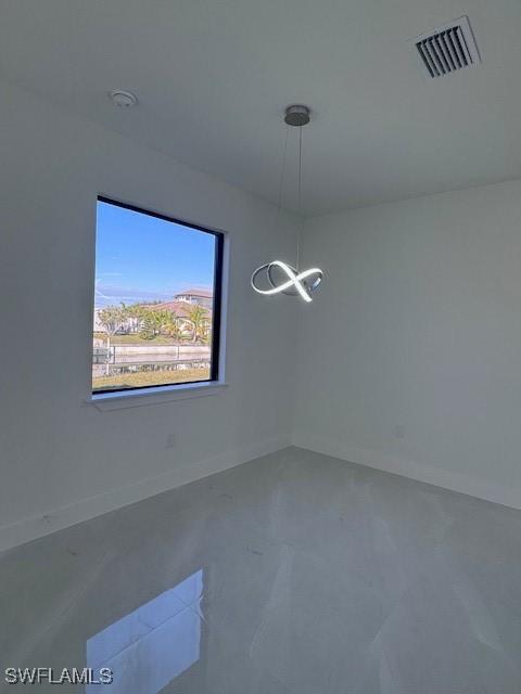 unfurnished dining area with concrete floors