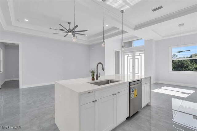 kitchen featuring dishwasher, white cabinetry, sink, and decorative light fixtures