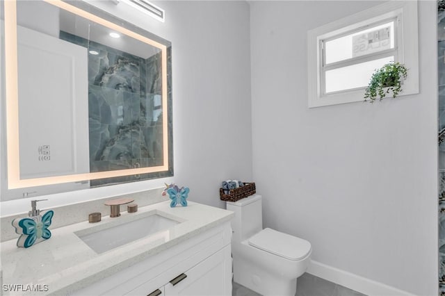 bathroom with tile patterned floors, vanity, toilet, and walk in shower