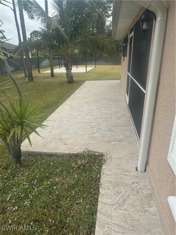 exterior space featuring a lawn and a patio