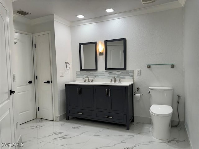 bathroom with tasteful backsplash, toilet, vanity, and ornamental molding