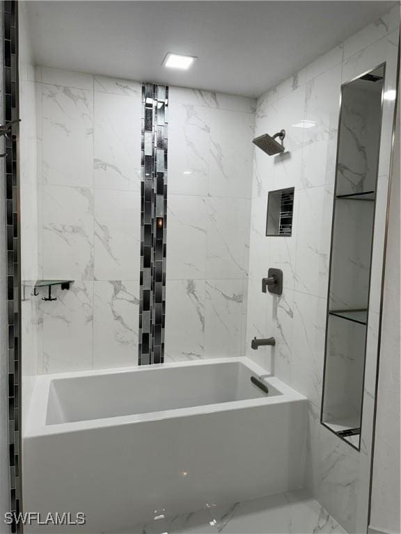 bathroom featuring tiled shower / bath combo