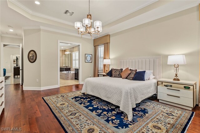 bedroom with a chandelier, crown molding, dark wood-type flooring, and ensuite bath