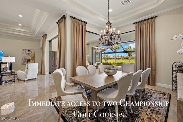 dining room with a raised ceiling, ornamental molding, and an inviting chandelier