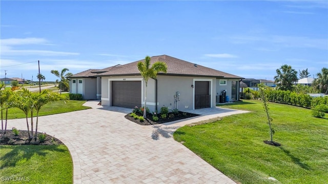 ranch-style home with a garage and a front yard